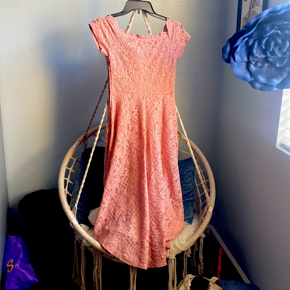 Pink dress with sparkles and floral pattern.